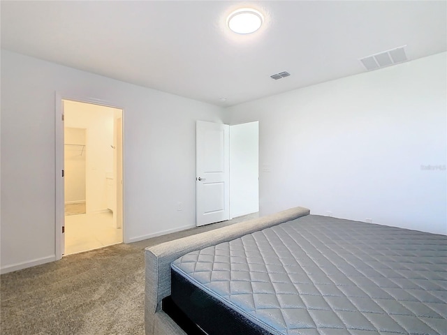 carpeted bedroom with visible vents