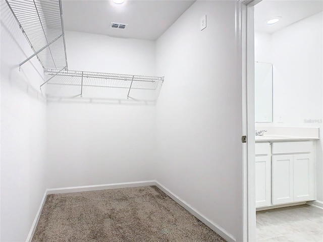 walk in closet featuring visible vents