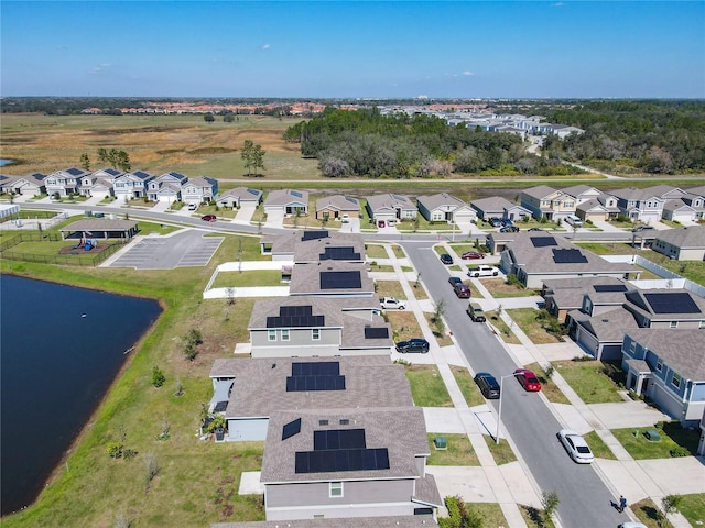 aerial view with a water view and a residential view