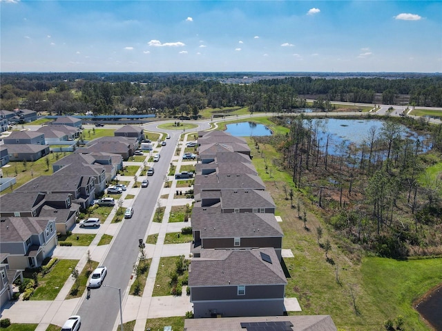 bird's eye view featuring a water view and a residential view