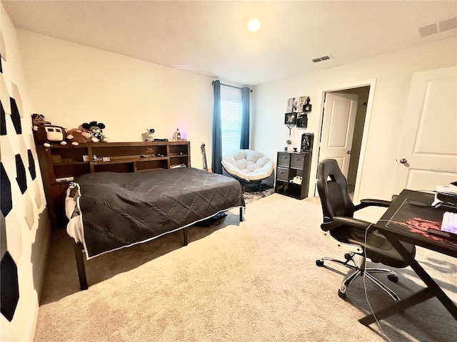 bedroom with visible vents and carpet flooring