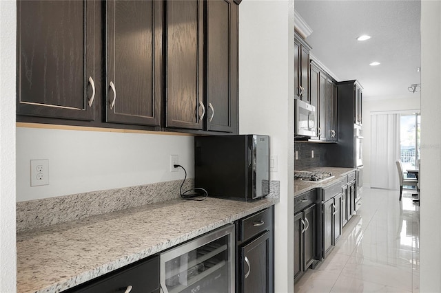 kitchen featuring wine cooler, marble finish floor, appliances with stainless steel finishes, dark brown cabinets, and crown molding