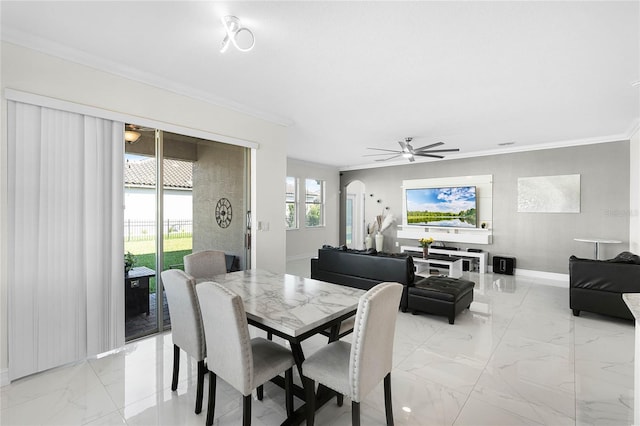 dining space with arched walkways, marble finish floor, crown molding, a ceiling fan, and baseboards