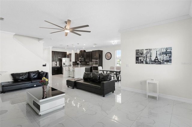 living area with marble finish floor, crown molding, visible vents, a ceiling fan, and baseboards