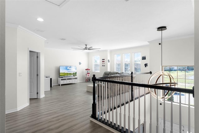 hall with crown molding, recessed lighting, an upstairs landing, wood finished floors, and baseboards