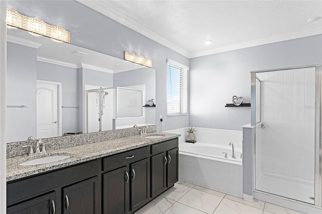 bathroom with ornamental molding, a sink, a bath, and a shower stall