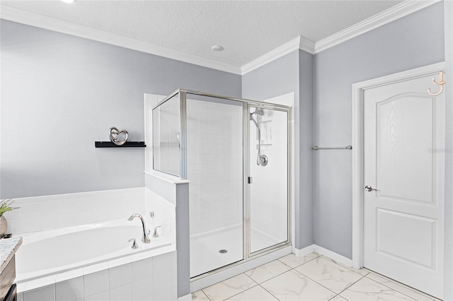 full bathroom featuring a stall shower, ornamental molding, a garden tub, marble finish floor, and a textured ceiling