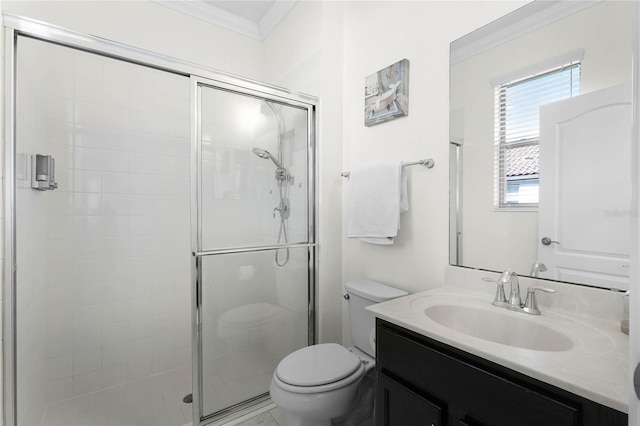 bathroom featuring ornamental molding, a stall shower, vanity, and toilet