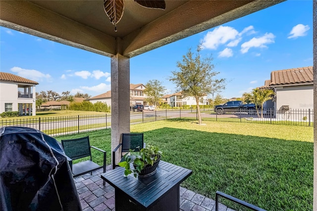 view of yard featuring a fenced backyard, a residential view, and a patio