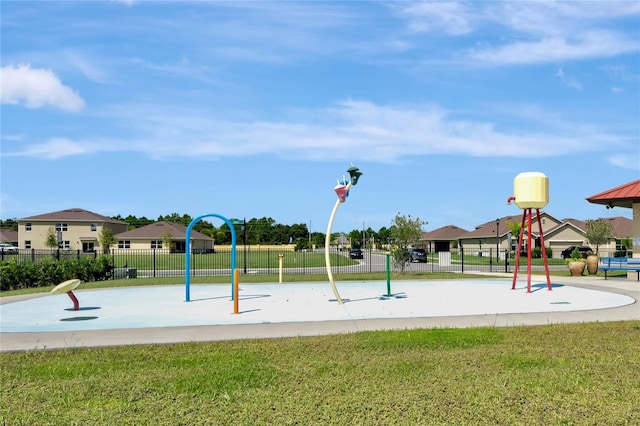 view of jungle gym with fence and a lawn