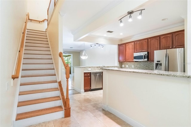 kitchen with tasteful backsplash, visible vents, appliances with stainless steel finishes, ornamental molding, and a peninsula