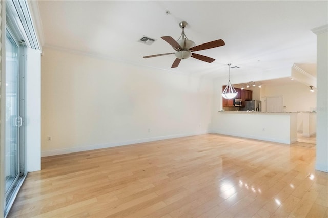 unfurnished living room featuring crown molding, light wood finished floors, visible vents, ceiling fan, and baseboards