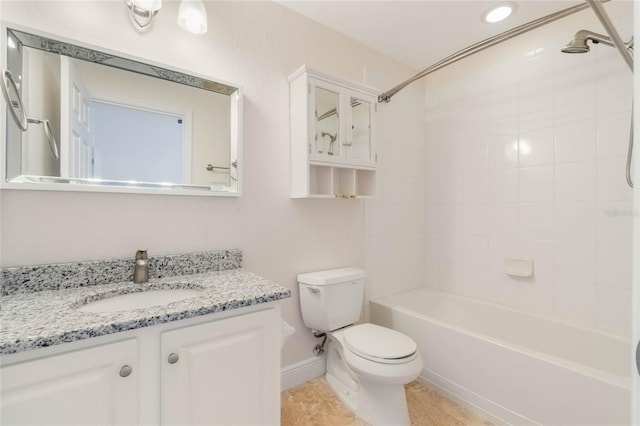 bathroom with shower / tub combination, tile patterned flooring, toilet, vanity, and baseboards