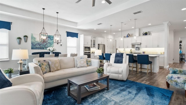 living area with baseboards, visible vents, ceiling fan, dark wood-style flooring, and recessed lighting