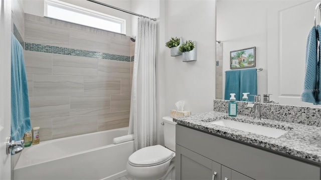 full bathroom with vanity, toilet, and shower / tub combo with curtain