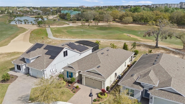 bird's eye view with view of golf course and a water view