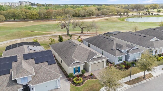 aerial view with view of golf course and a water view