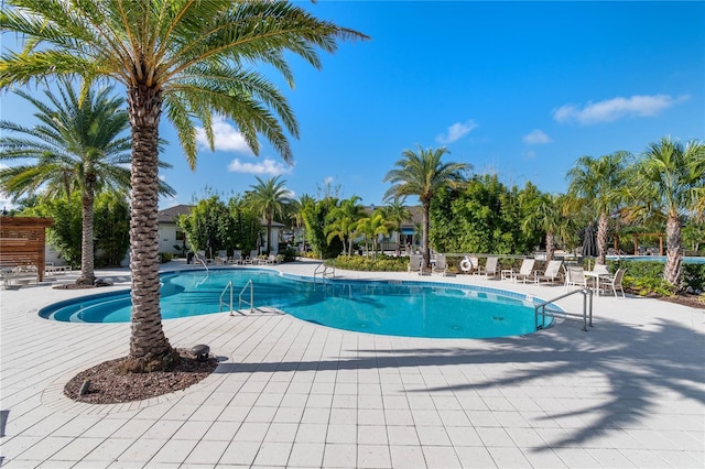 community pool with a patio