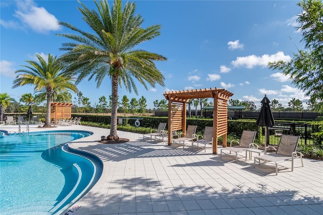 pool featuring a patio area, fence, and a pergola