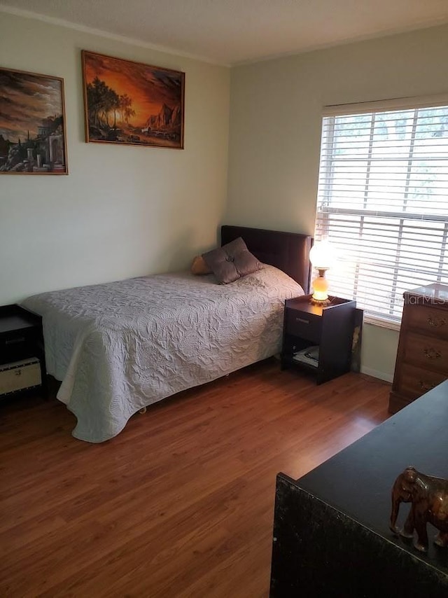 bedroom featuring wood finished floors