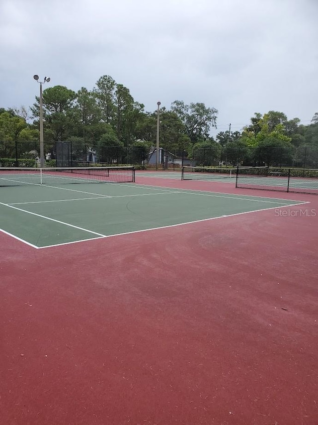 view of sport court featuring community basketball court and fence