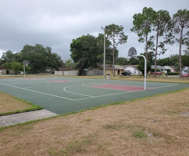 view of basketball court with community basketball court and fence