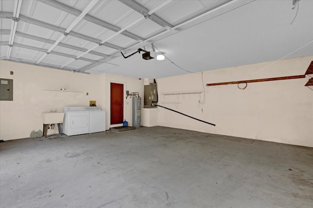 garage with a garage door opener, water heater, washing machine and dryer, a sink, and electric panel