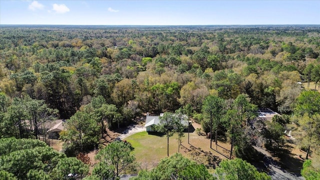 bird's eye view featuring a forest view