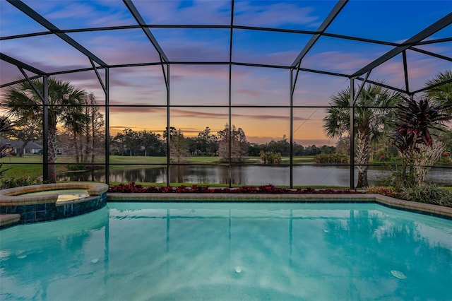 view of pool featuring a lanai, a water view, and a pool with connected hot tub