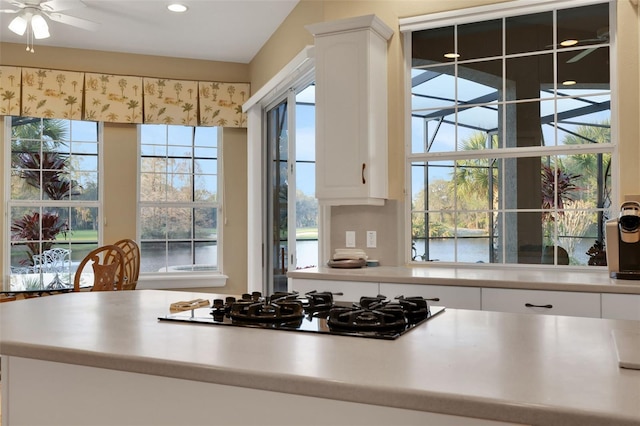 kitchen with white cabinets, ceiling fan, light countertops, gas cooktop, and recessed lighting