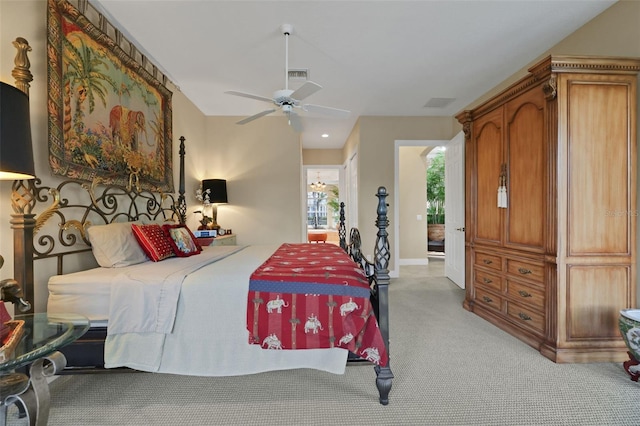 bedroom with a ceiling fan, light colored carpet, visible vents, and baseboards