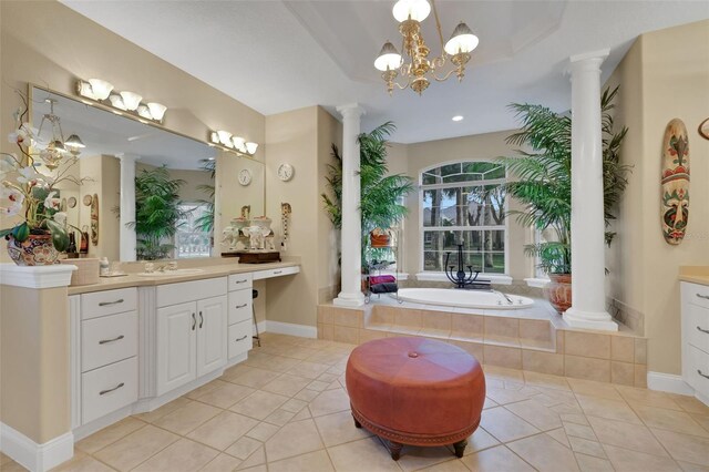 bathroom featuring ornate columns, vanity, and tile patterned floors