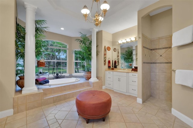 bathroom featuring decorative columns, vanity, a walk in shower, tile patterned flooring, and a bath