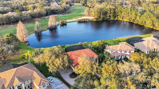 drone / aerial view featuring a water view and a residential view