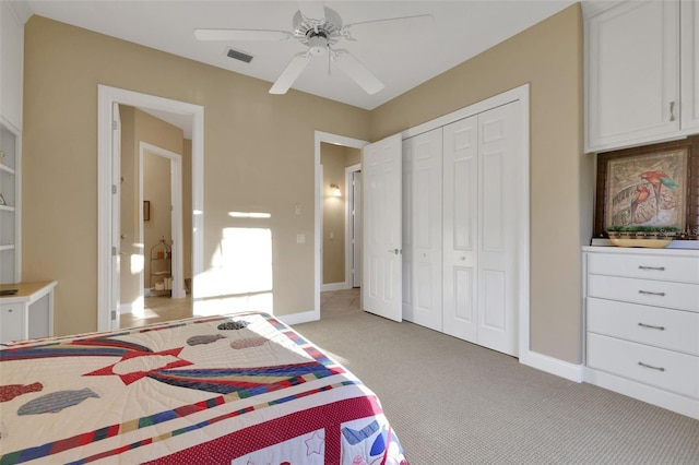 bedroom featuring a ceiling fan, baseboards, a closet, and light colored carpet