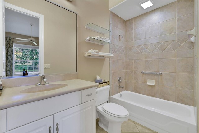 bathroom with shower / bathtub combination, tile patterned flooring, toilet, vanity, and a ceiling fan