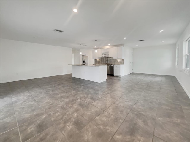 unfurnished living room with recessed lighting, tile patterned flooring, visible vents, and baseboards