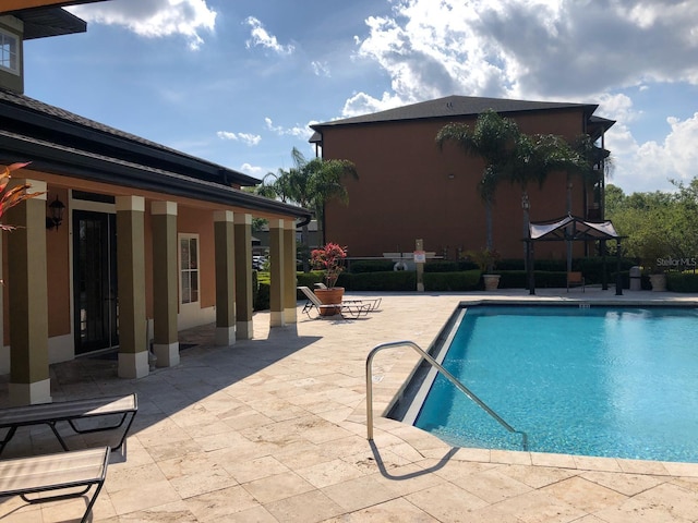 pool featuring a patio