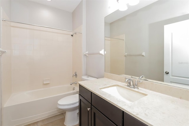 bathroom featuring shower / washtub combination, vanity, toilet, and tile patterned floors