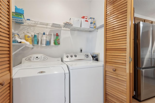 washroom with washer and dryer and laundry area