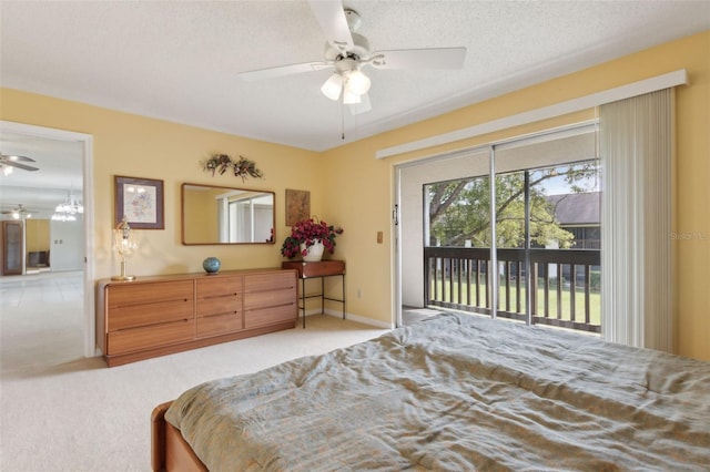 bedroom with access to exterior, baseboards, carpet flooring, a textured ceiling, and a ceiling fan