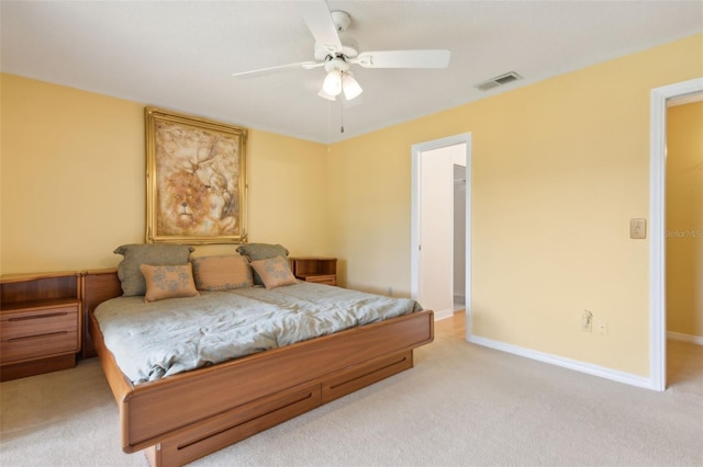 bedroom featuring light carpet, visible vents, ceiling fan, and baseboards