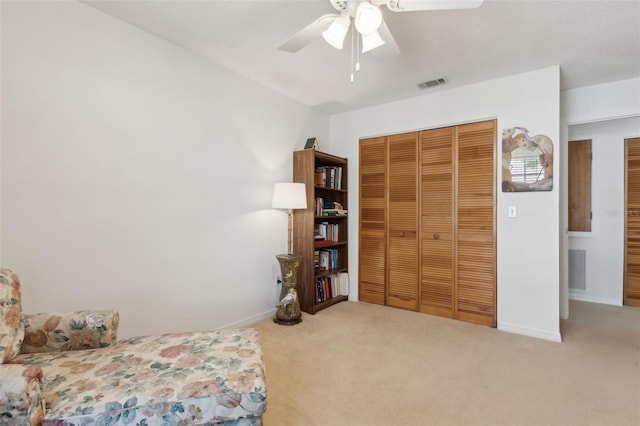 bedroom with a closet, visible vents, carpet flooring, and baseboards