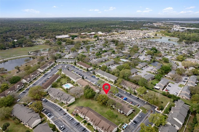 birds eye view of property featuring a residential view and a water view