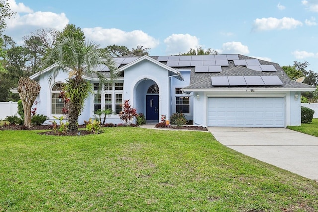 ranch-style home featuring roof with shingles, stucco siding, concrete driveway, an attached garage, and a front yard