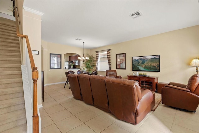 living room with stairway, light tile patterned floors, visible vents, and a chandelier