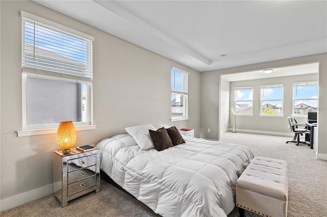 carpeted bedroom with baseboards