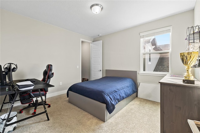 carpeted bedroom with baseboards