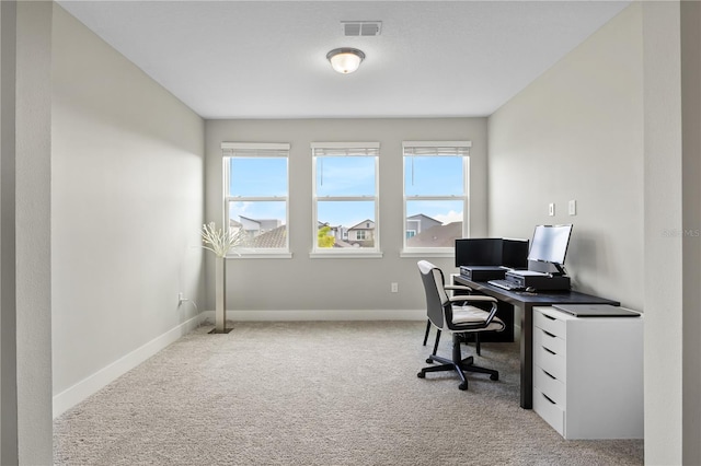 office area with baseboards, visible vents, and carpet flooring