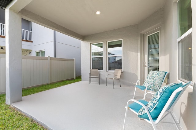 view of patio / terrace featuring fence